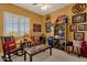 Sports-themed bedroom with a sitting area and shelves at 15439 E Acacia Way, Fountain Hills, AZ 85268