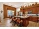 Gourmet kitchen boasts granite countertops, custom cabinetry, and stainless steel appliances at 15439 E Acacia Way, Fountain Hills, AZ 85268