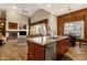 Open kitchen with granite island, stainless steel appliances, and a view of the living area at 15439 E Acacia Way, Fountain Hills, AZ 85268