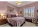 Spacious bedroom with a queen-size bed and calming decor at 15439 E Acacia Way, Fountain Hills, AZ 85268