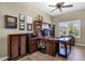 Home office with built-in wooden desk and shelving at 15439 E Acacia Way, Fountain Hills, AZ 85268
