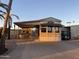 Mobile home exterior showcasing covered patio and landscaping at 1206 W Klamath Dr, Apache Junction, AZ 85119