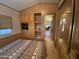 Spacious bedroom with mirrored closet and view into hallway at 1206 W Klamath Dr, Apache Junction, AZ 85119