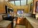 Well-lit kitchen featuring stainless steel appliances and wood cabinets at 1206 W Klamath Dr, Apache Junction, AZ 85119