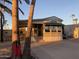 Mobile home exterior view with covered patio and golf cart at 1206 W Klamath Dr, Apache Junction, AZ 85119