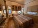 Bright bedroom featuring a mirrored closet and window at 1206 W Klamath Dr, Apache Junction, AZ 85119