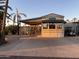 Mobile home exterior with covered patio and parking at 1206 W Klamath Dr, Apache Junction, AZ 85119