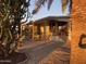Covered patio with seating area, providing a relaxing outdoor space at 1206 W Klamath Dr, Apache Junction, AZ 85119
