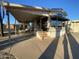 Mobile home exterior with covered patio and landscaping at 1206 W Klamath Dr, Apache Junction, AZ 85119