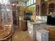 Kitchen with stainless steel appliances, wood cabinets, and tile countertops at 1206 W Klamath Dr, Apache Junction, AZ 85119