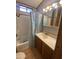 Bathroom featuring a shower/tub, vanity, and linen closet at 1206 W Klamath Dr, Apache Junction, AZ 85119