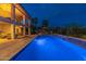 Night view of a refreshing pool and patio area with dramatic lighting at 15857 E Ponderosa Dr, Fountain Hills, AZ 85268