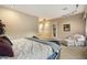 Spacious Primary bedroom with plush bedding and seating area at 2378 N 158Th Dr, Goodyear, AZ 85395