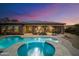 Stunning pool and patio with solar panels and fire pit at 2378 N 158Th Dr, Goodyear, AZ 85395