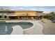 Spacious pool and patio area with fire pit and seating at 2378 N 158Th Dr, Goodyear, AZ 85395