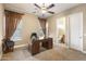 Spacious home office with built-in desk and en-suite bathroom at 2378 N 158Th Dr, Goodyear, AZ 85395