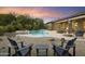 Relaxing backyard with pool, fire pit, and seating at 2378 N 158Th Dr, Goodyear, AZ 85395