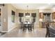 Bright breakfast nook with a table and chairs, overlooking backyard at 2378 N 158Th Dr, Goodyear, AZ 85395