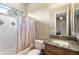 Clean bathroom with shower/tub combo, granite vanity, and updated fixtures at 2378 N 158Th Dr, Goodyear, AZ 85395
