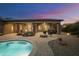 Relaxing backyard with pool, patio, and fire pit at 2378 N 158Th Dr, Goodyear, AZ 85395