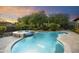 Inviting pool and spa with fire pit and seating area at 2378 N 158Th Dr, Goodyear, AZ 85395