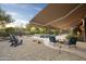 Landscaped backyard oasis with pool and fire pit at 2378 N 158Th Dr, Goodyear, AZ 85395