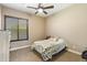 Comfortable bedroom with a queen bed and ceiling fan at 2378 N 158Th Dr, Goodyear, AZ 85395