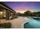 Luxury backyard with pool, patio, and fire feature at 2378 N 158Th Dr, Goodyear, AZ 85395