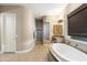 Spa-like bathroom with a walk-in shower and soaking tub at 2378 N 158Th Dr, Goodyear, AZ 85395