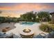 Stunning backyard with sparkling pool and fire pit at 2378 N 158Th Dr, Goodyear, AZ 85395