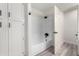 Clean bathroom with a shower/tub combo and linen closet at 10338 E San Salvador Dr, Scottsdale, AZ 85258