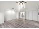 Bright bedroom with wood-look floors and access to upper level at 10338 E San Salvador Dr, Scottsdale, AZ 85258