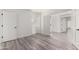 Well-lit bedroom with wood-look floors and double doors at 10338 E San Salvador Dr, Scottsdale, AZ 85258