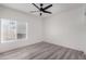 Bright bedroom with ceiling fan and hardwood floors at 10338 E San Salvador Dr, Scottsdale, AZ 85258