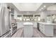 Modern kitchen with white cabinets, quartz countertops, and stainless steel appliances at 10338 E San Salvador Dr, Scottsdale, AZ 85258