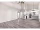 Open concept kitchen with island, white cabinets and stainless steel appliances at 10338 E San Salvador Dr, Scottsdale, AZ 85258