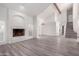 Bright living room with vaulted ceiling, hardwood floors, and a fireplace at 10338 E San Salvador Dr, Scottsdale, AZ 85258