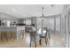 Kitchen and dining area with breakfast bar and glass dining table at 16453 W Central St, Surprise, AZ 85388