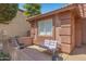 Peaceful front patio with small sitting area and lighting at 16453 W Central St, Surprise, AZ 85388