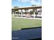 Relaxing community patio area with covered seating and grassy lawn at 4630 N 68Th St # 248, Scottsdale, AZ 85251