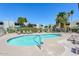 Inviting kidney-shaped pool with surrounding lounge chairs at 4630 N 68Th St # 248, Scottsdale, AZ 85251