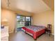 Serene bedroom with patio access and tiled floors at 4630 N 68Th St # 248, Scottsdale, AZ 85251