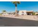 House exterior with arched entryways and a palm tree at 8228 E Calypso Ave, Mesa, AZ 85208