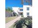 Two-story building with a walkway and landscaping at 8214 E Mcdonald Dr, Scottsdale, AZ 85250