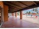 Covered patio area overlooking the community pool at 8214 E Mcdonald Dr, Scottsdale, AZ 85250
