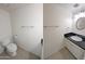 Clean bathroom with toilet, sink, and vanity at 8214 E Mcdonald Dr, Scottsdale, AZ 85250