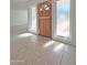 Bright entryway with wood door and tile flooring at 8214 E Mcdonald Dr, Scottsdale, AZ 85250