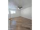 Large bedroom with wood-look flooring and ceiling fan at 8214 E Mcdonald Dr, Scottsdale, AZ 85250