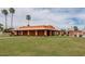 Community building with grassy area and pool at 8214 E Mcdonald Dr, Scottsdale, AZ 85250