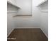 Large closet with built-in shelves and a sitting bench at 8214 E Mcdonald Dr, Scottsdale, AZ 85250